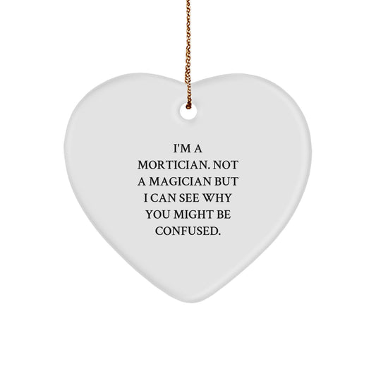 Mortician Gifts from Friends, Family, or Coworkers - I'm A Mortician. Not A Magician. Funny Heart Ornament for Christmas - Image 1